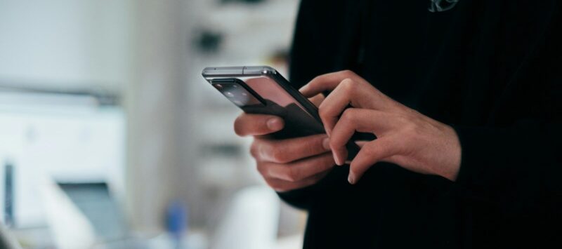 person holding black android smartphone