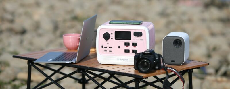 a table with a camera and a camera on it
